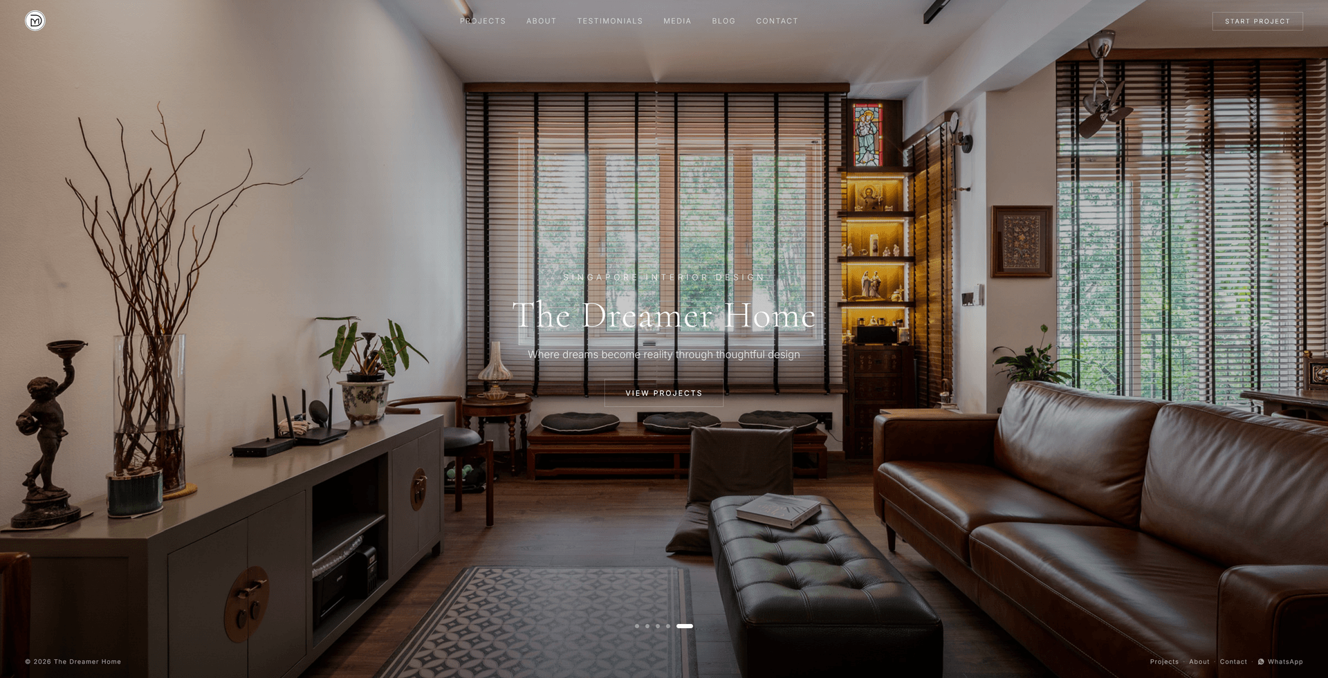 The Dreamer Home website opening on a full-width photograph of a completed living room