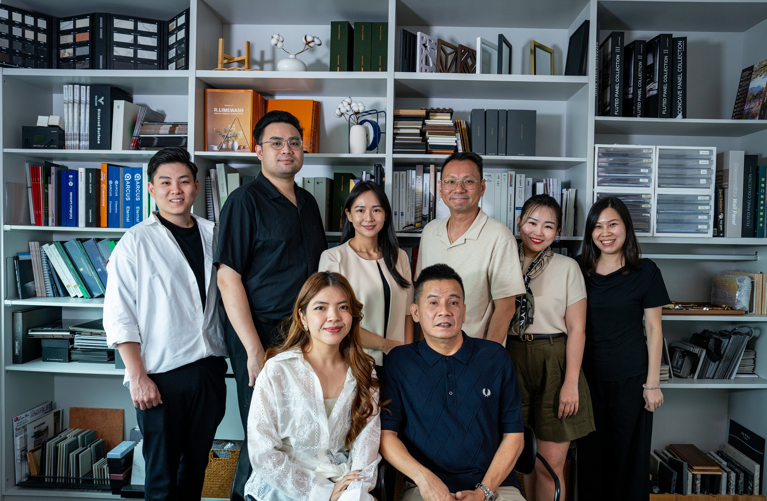 The Dreamer Home team portrait in front of the showroom material library