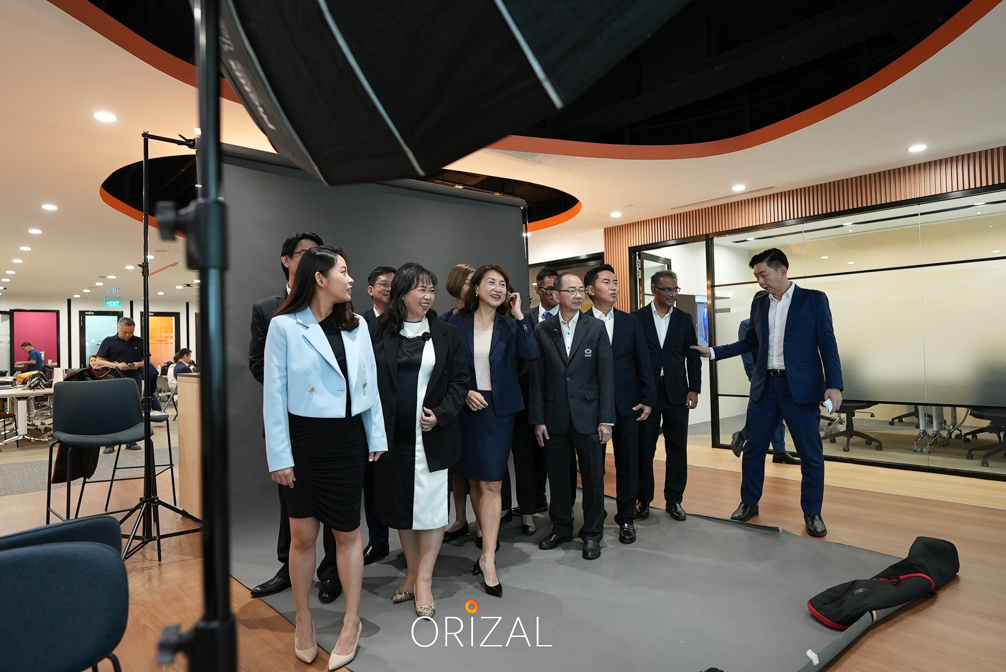 Orizal colleagues gathering in front of the photoshoot backdrop