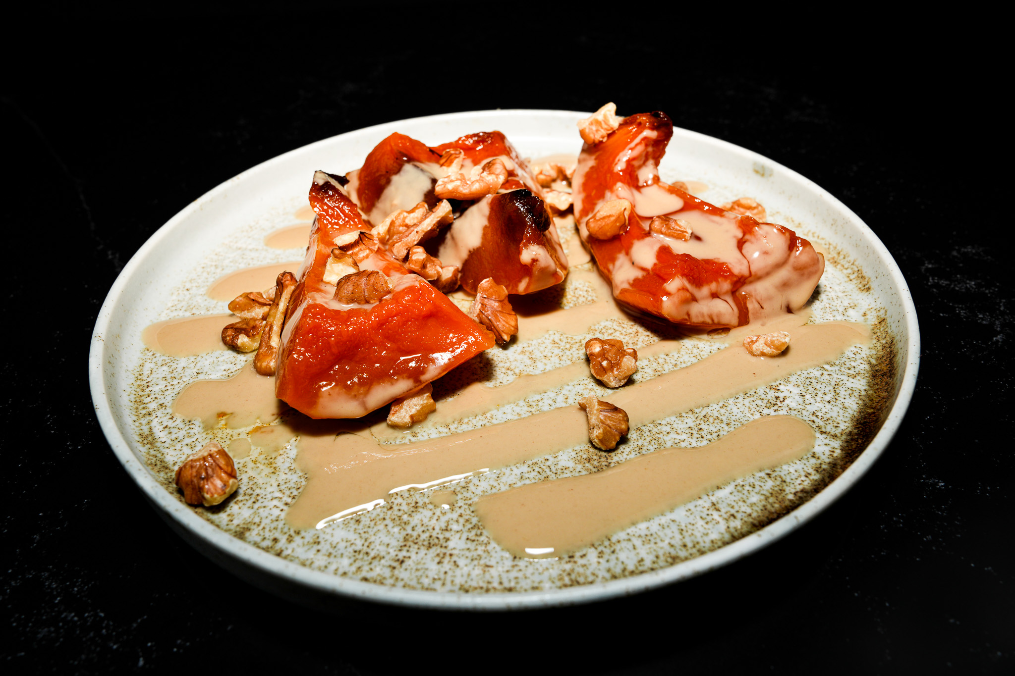 Pumpkin dessert with tahini drizzle and nuts