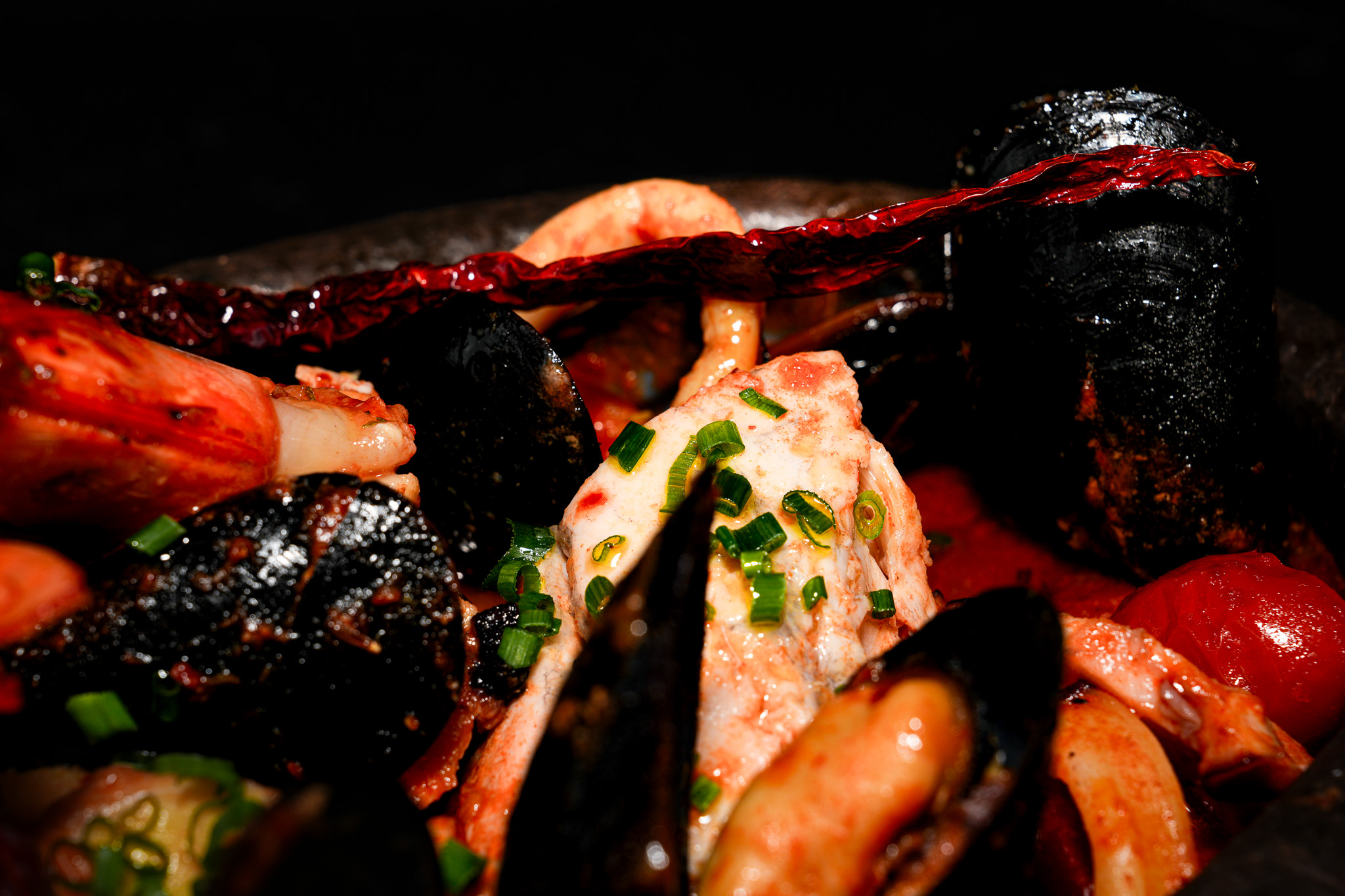 Close-up of prawns and mussels in a seafood skillet