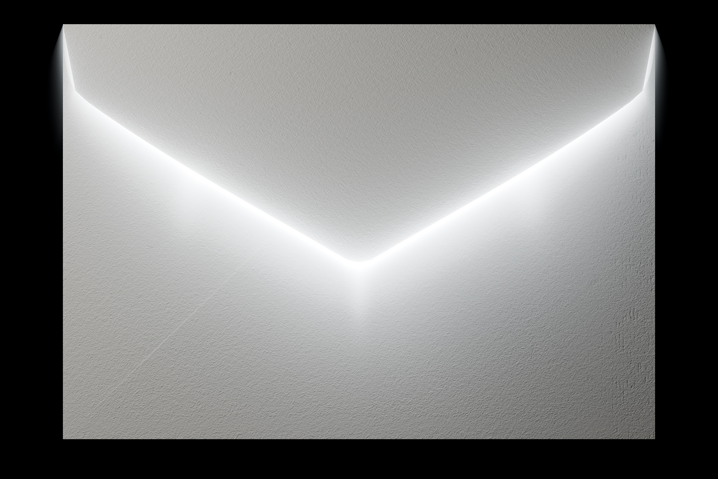 A textured envelope with light passing beneath its flap against a black background.